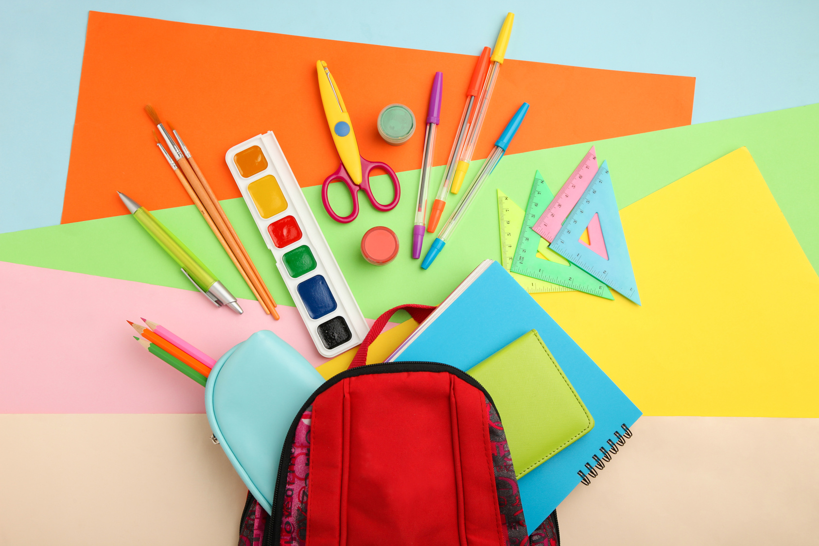 Schoolbag with different school supplies